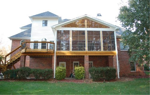Sunroom addition with large windows